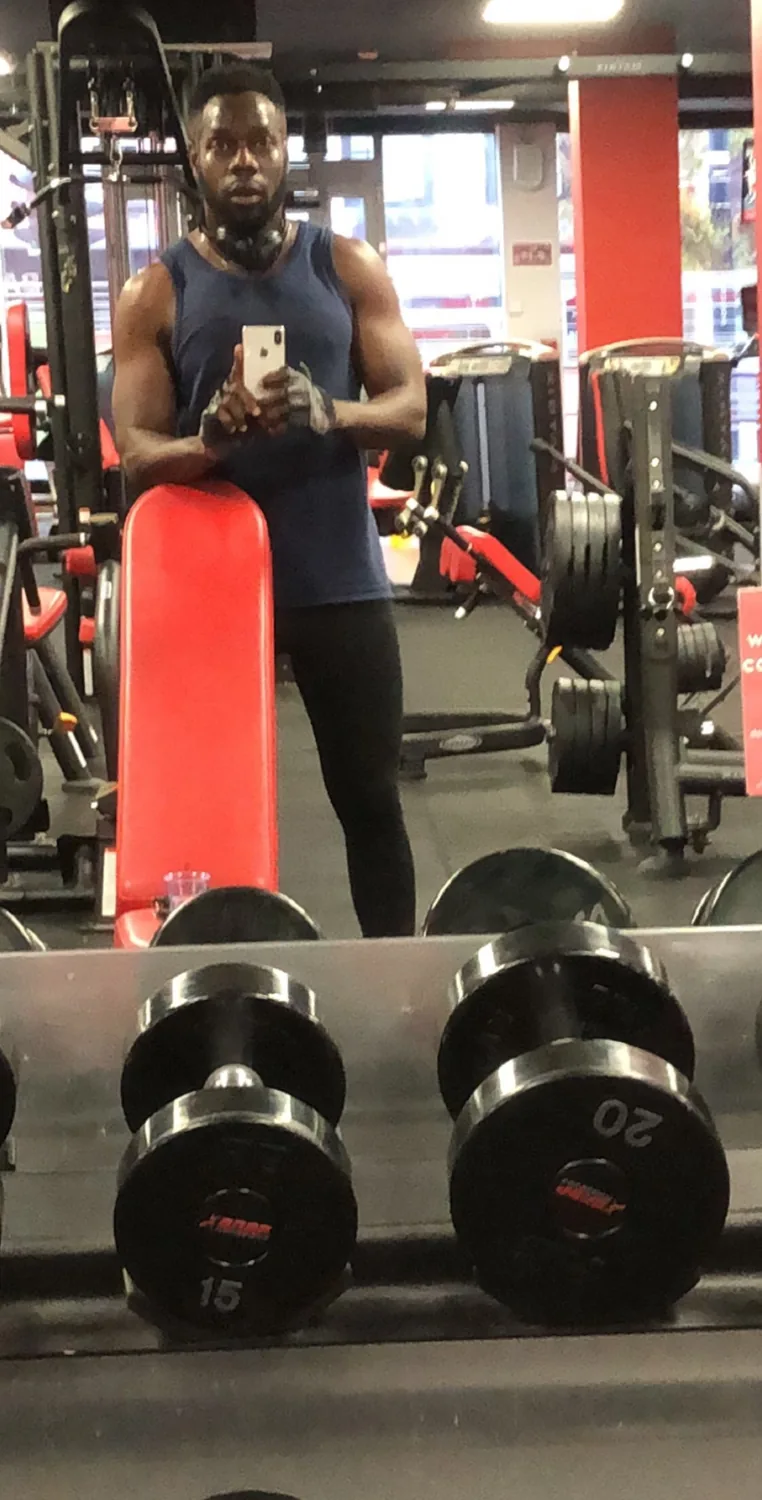 Denis taking a mirror photo at the gym