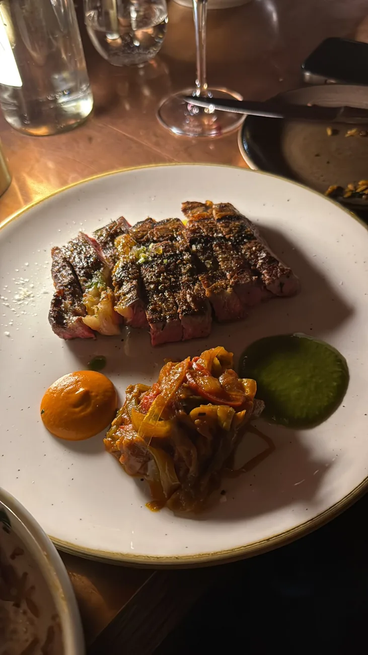 Plated steak with vegetables at a restaurant